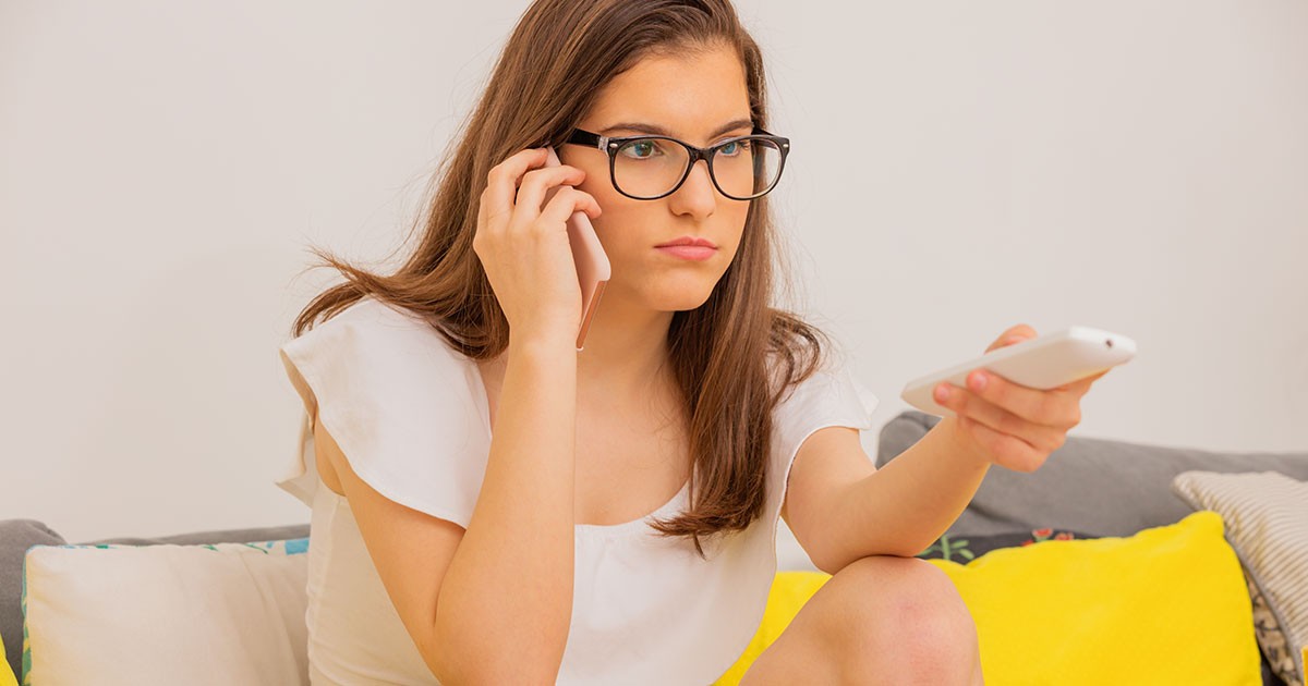 pre-teen on phone with remote