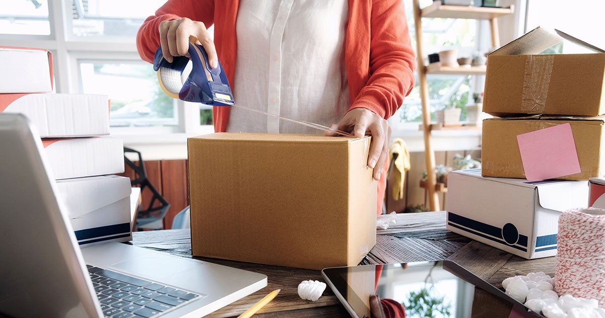 Small business owner prepares a package for shipping