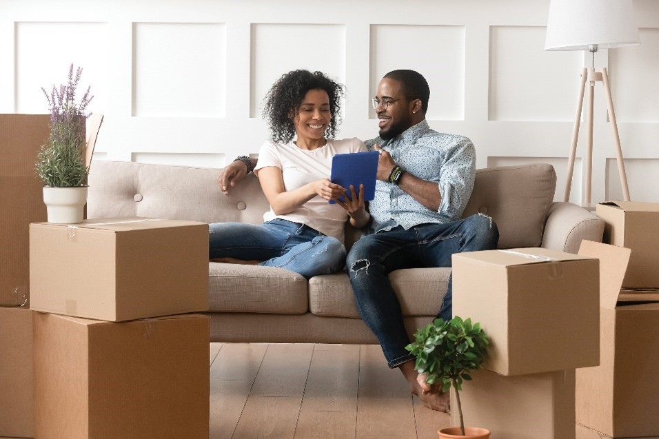 A couple connects to WiFi and explored multifamily amenities as soon as they move into their new apartment