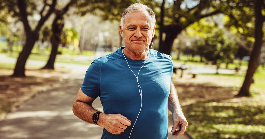 Man jogs through the park while streaming music thanks to 5G.