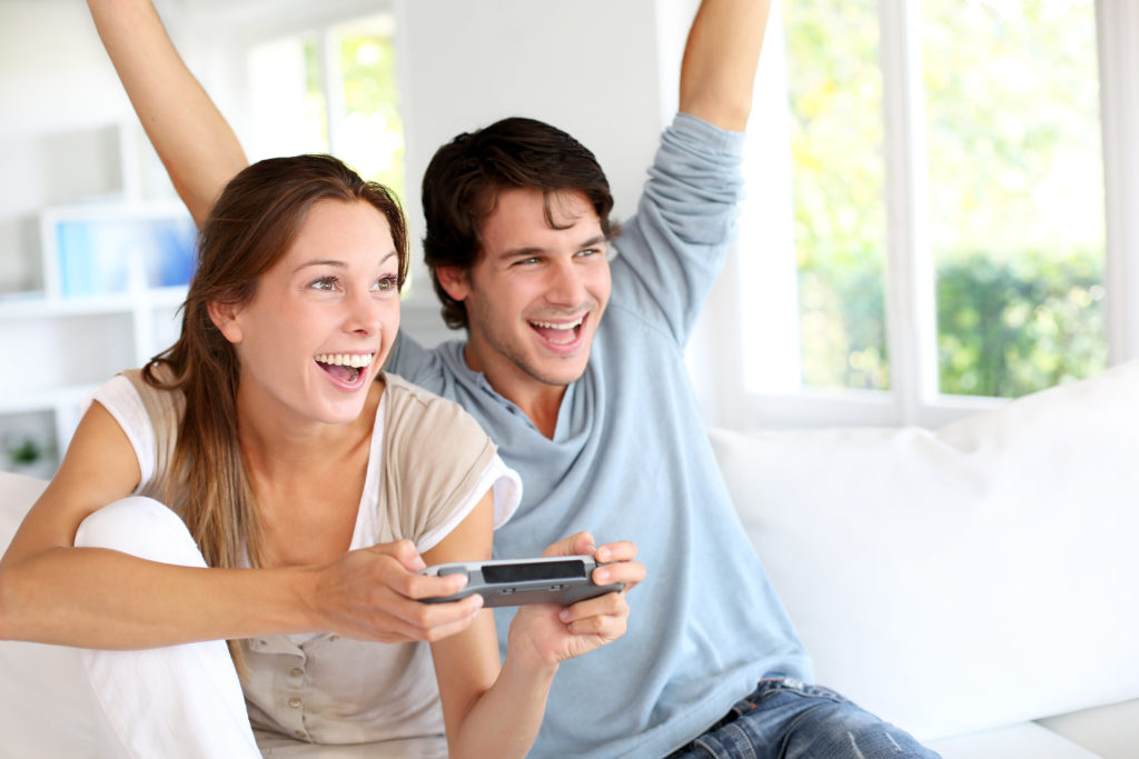 Couple playing online games for date night.