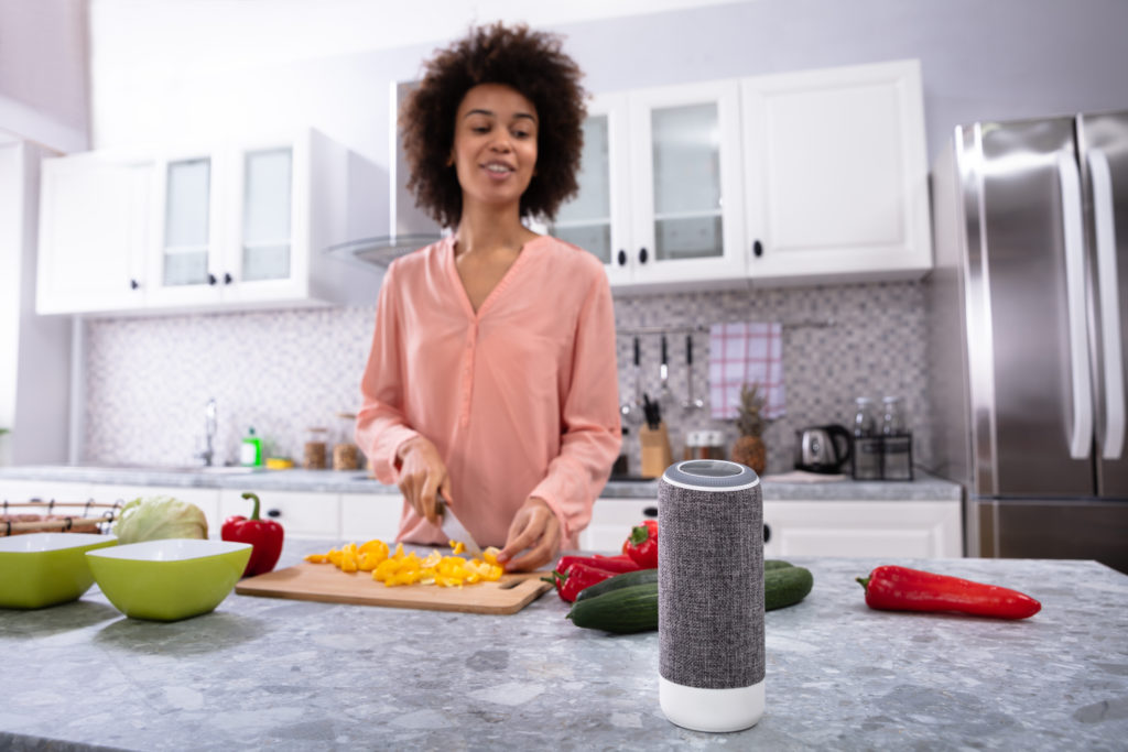 Woman in smart home kitchen