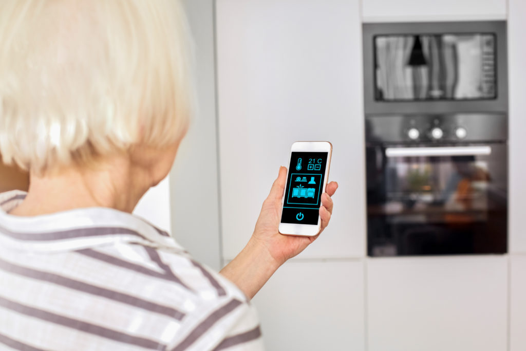 Woman using AI for smart oven