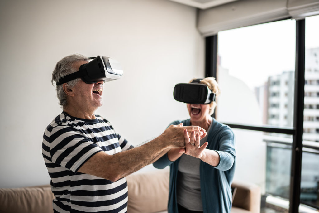 Senior couple using VR accessories