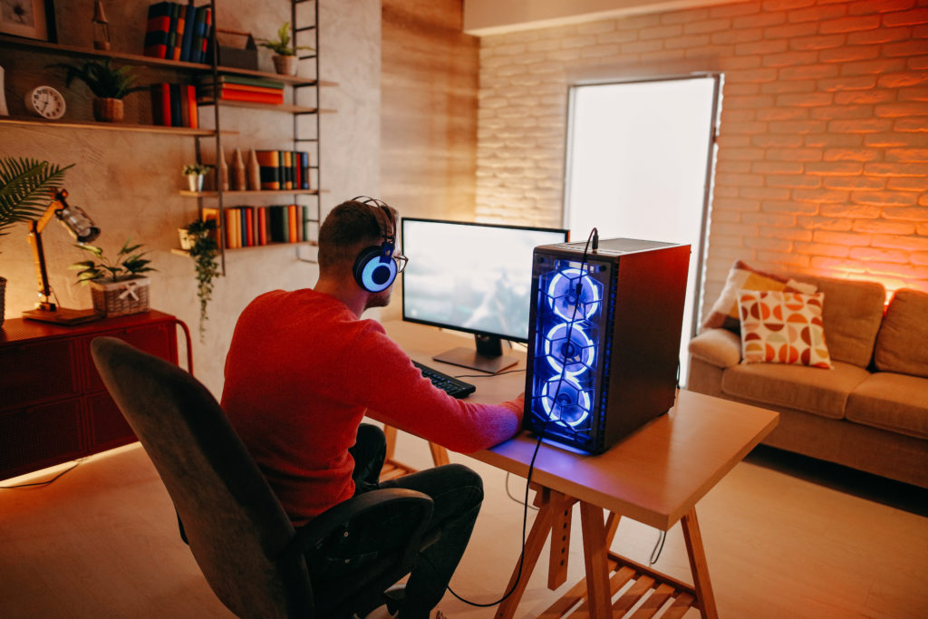 Man playing video games on a prebuilt PC