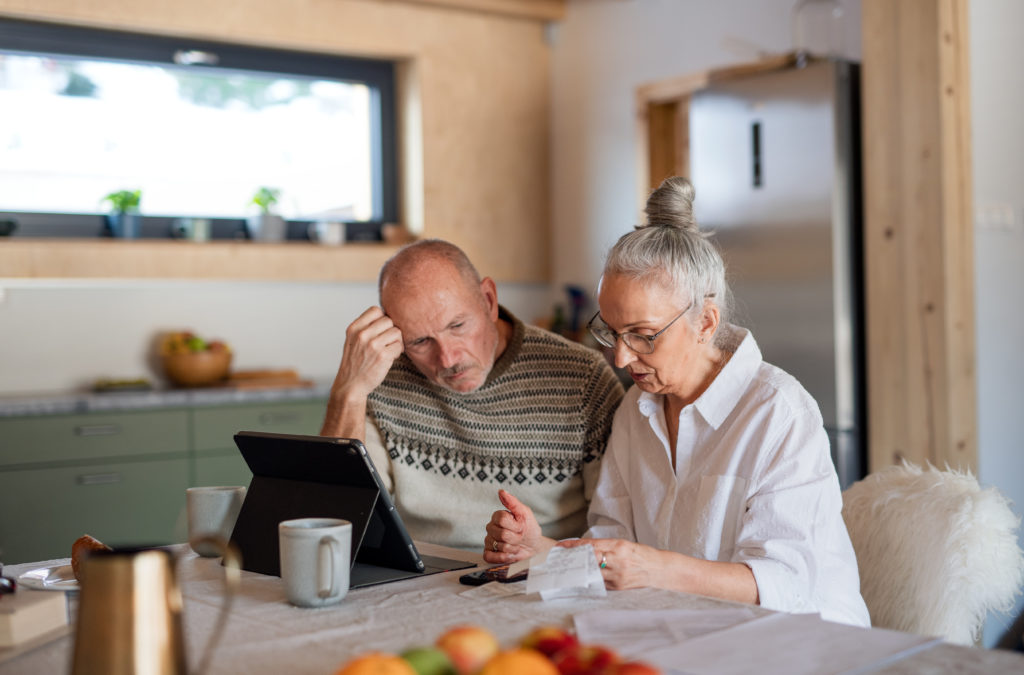 Senior couple cutting costs during inflation